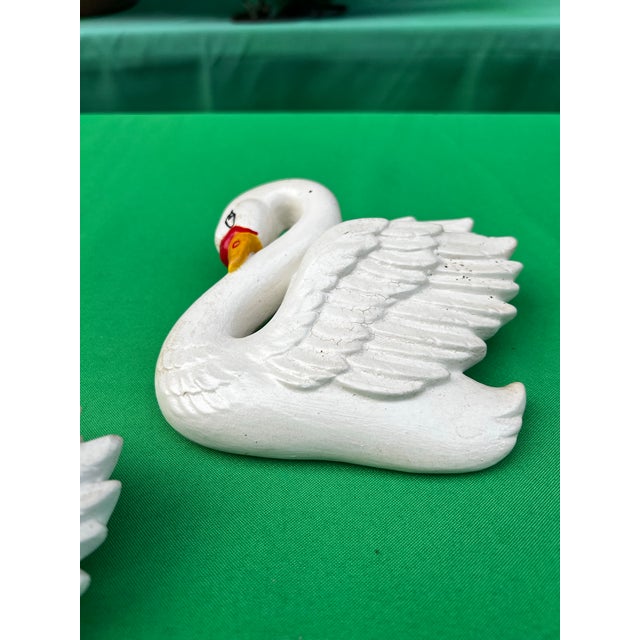 Up for consideration is a beautiful vintage pair of small ceramic swan figurine wall hangings. These would look lovely in...