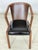 Armchair in a timeless retro design with a beautifully curved wooden backrest and a comfortable seat cushion upholstered...