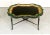 A well crafted carved, ebonized, and gilt serpentine tray table with beautifully painted accents and a detachable tray...