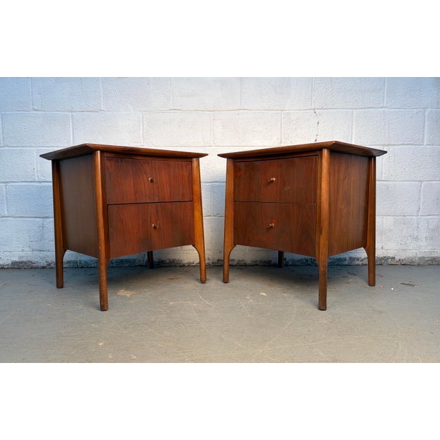 Bring refined mid-century character to your bedroom with these curved front Nightstands. Crafted with attention to detail,...