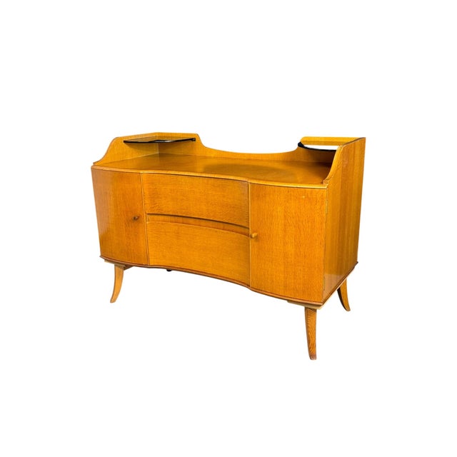 This vintage mid-century modern dressing table was created around 1960. It features a streamlined design characteristic of...