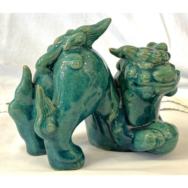 A striking vintage Yang foo dog from the mid 20th century. It is hand made of heavy ceramic with wonderful details and...