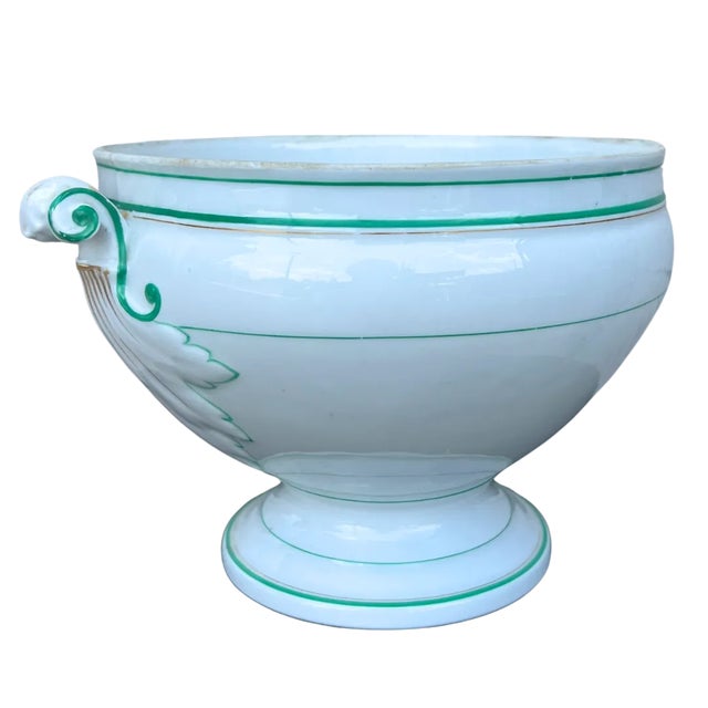 A gorgeous early-20th century white porcelain tureen trimmed in a lovely blue/green and gold. The lidless tureen has...