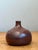 This exquisite hand-signed bud vase by P.F. McBride is a quintessential example of artisanal studio pottery. Thrown with a...