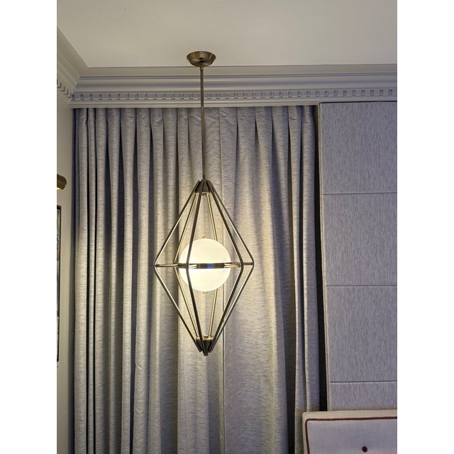A set of Frederick Ramond spectra lights; buy a pair or separately. We had them hanging in a bedroom for 6 years. Very...