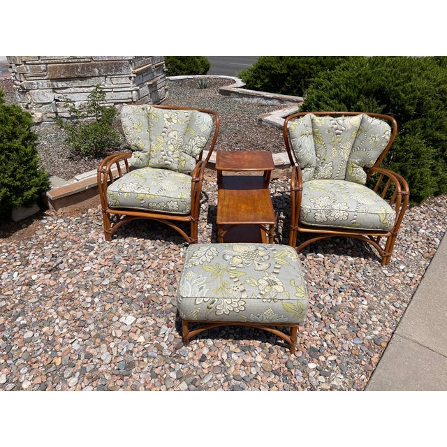 Mid-Century "1949er" Rattan living-room set including two lounge chairs with complimentary foot stool and a side table....