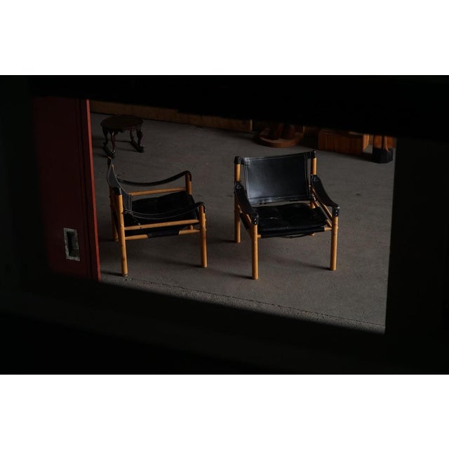 A beautiful pair of "sirocco" safari chairs designed by arne norell and produced by arne norell ab in sweden during the...
