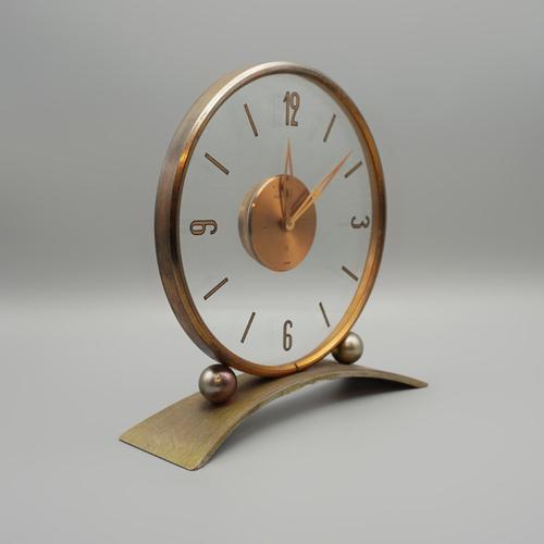 An Art Deco Mantel Clock by Jaeger Lecoultre. Gilt brass framed with glass case and clear glass background. Original 8 day...