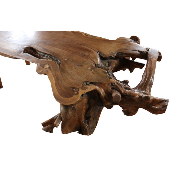 Solid rootwood coffee table with a free-form, organic silhouette. Exact wood species undocumented; the density, weight and...