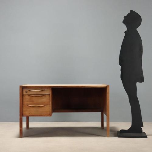 1960s desk made of wood with a formica top and two under-desk drawers, perfect for organizing documents and office...