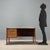 1960s desk made of wood with a formica top and two under-desk drawers, perfect for organizing documents and office...