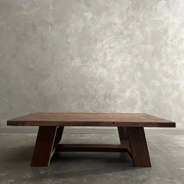 Versa Elm Wood Coffee Table in Walnut Finish These old elm timbers show in its most primal, natural form. The artisanal...