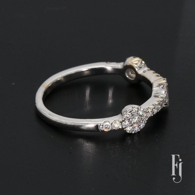Here is a 14k White Gold Engagement Ring with Three 0.03ct. G/H SI2 Round Diamonds & Thirty-Six 0.01ct. G/H SI2 Round...