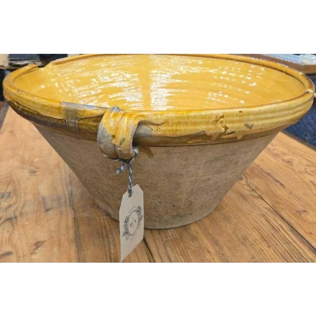 A beautifully aged French terracotta confit bowl dating to the late 19th century. Once used for preserving foods such as...