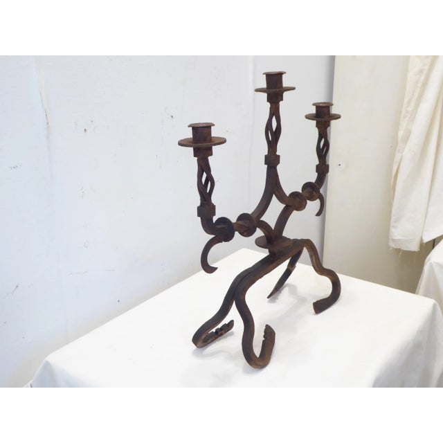 Early 19th Century Continental heavy weight iron three arm candelabra, uses standard size tapers.