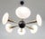 Italian chandelier with Murano glass shades, mounted on polished brass frame with black enameled center and ceiling canopy...