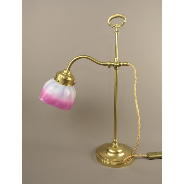 Adjustable table lamp with glass shade The lamp has been rewired and re-electrified to today's safety standards for use in...