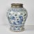 Yuan Dynasty- style jar with pewter rim (as used in Spice Road), featuring hand-painted scenes of figures in a garden....