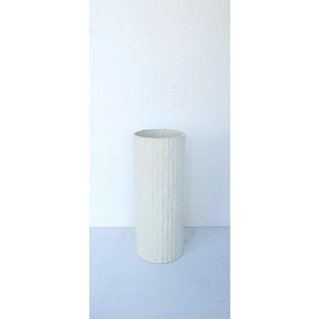 An Italian white ceramic umbrella holder stand with bamboo design, circa mid-20th century, Italy. Faint imprint mark on...