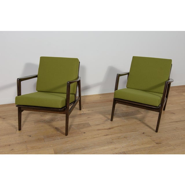 This pair of armchairs was produced by the Polish company Swarzędzka Furniture Factory in 60s.The armchairs have new...