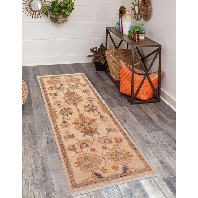 Enhance the ambiance of your home with this magnificent Persian-influenced Turkish hand-knotted rug made by skilled...