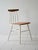 1960s Scandinavian chair with shaped wooden seat and white painted wooden structure. The distinctive aspect of this chair...