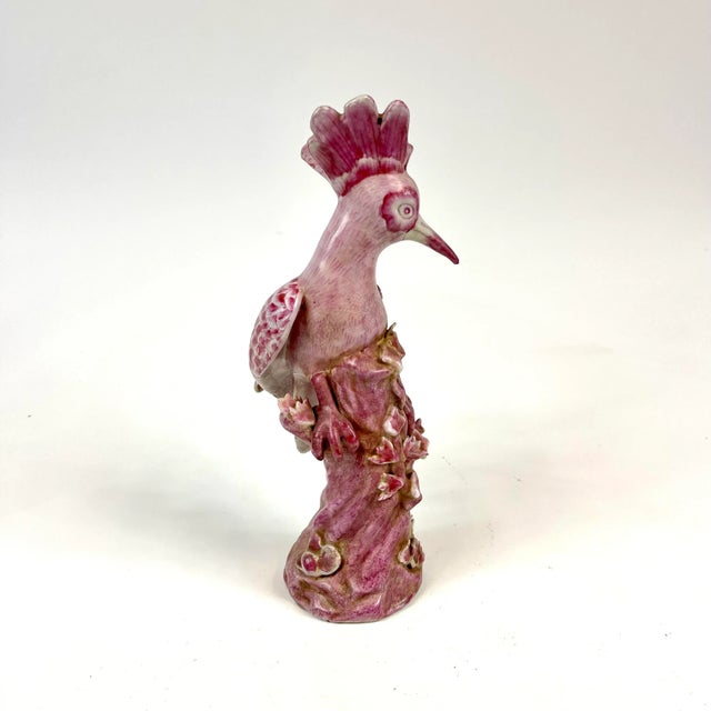 A beautifully hand painted porcelain bird on a flowering tree. No transfers were used in the design. The bottom is felted