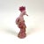 A beautifully hand painted porcelain bird on a flowering tree. No transfers were used in the design. The bottom is felted