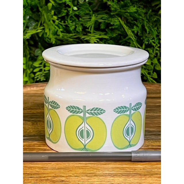 This a very quaint vintage Arabia Pomona jar featuring a mid-century modern green apple scroll design. The jar was...
