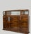 An impressive Art Deco sideboard and glass display cabinet, handcrafted in walnut veneer with a deep, lustrous finish. The...