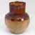 A small antique salt glazed jug in two shades of brown glaze decorated with applied tavern scene figures, a windmill and...