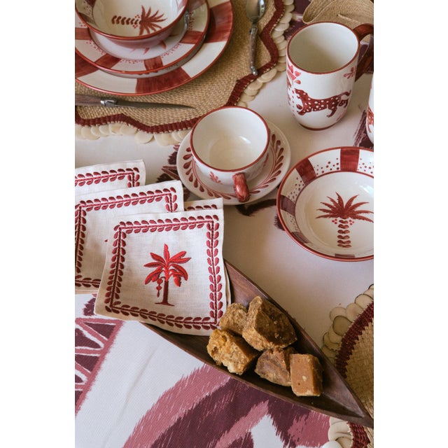 The "Casa Collection '24" features tablecloths and napkins in Navy, Red, and Aqua, embodying Johanna Ortiz's tropical chic...