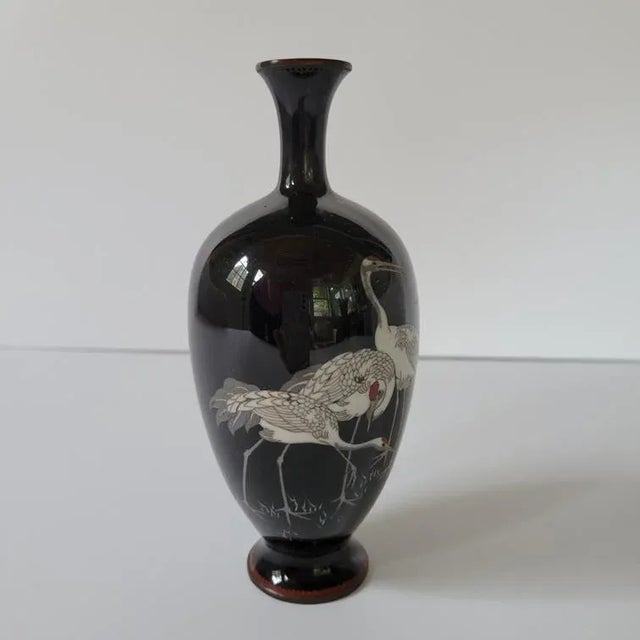 Late 19th C Japanese copper cloisonné vase with superb decoration depicting, on a glossy black ground, a group of 3 cranes...