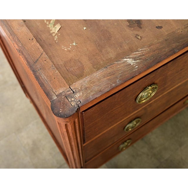 Dimensions: 35” H x 50 ¾” W x 25 ¼” D A handsome walnut & marble commode from France, an 18th century original in the...