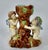 Charming antique majolica spill vase with playful cherubs climbing a tree trunk, finished in rich, colorful glaze. A late...
