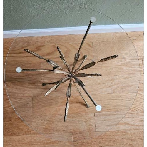 Beautiful and delicate accent round table with a sheaf of wheat gold metal base, crowned by a round glass top, in the...