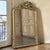 A 19th century French Napoleon III period gilded mirror, as luminous today as when it first graced a Parisian salon. An...