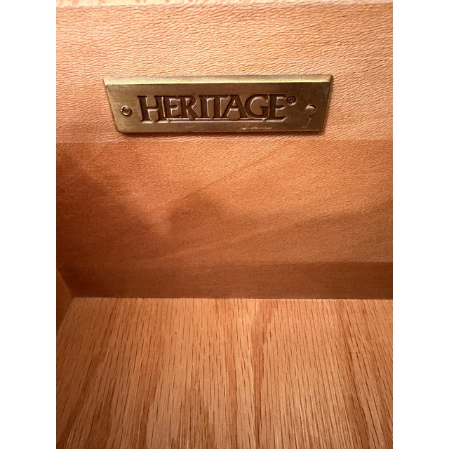 A beautifully crafted vintage armoire from the esteemed Drexel Heritage Corinthian Collection, finished in a rich olive...