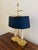 A gorgeous brass bouillotte lamp with black tole shade USA, Mid-20th century Measures: 9" W x 6.25" D x 16" H Very good...