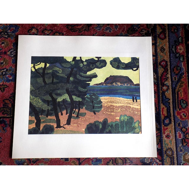 This pair of signed vintage Japanese fauvist lithographs depict Japanese landscape woodblock prints. The second image is...