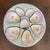 This antique Carl Tielsch porcelain oyster plate features distinctive pink luster wells and a central shell motif, dating...