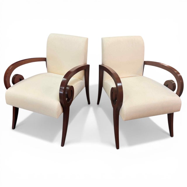 A pair of Kensington lounge chairs, designed by Stanley Jay Friedman for Brueton. Solid maple frames are finished in a...