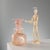 A blown Scavo glass vase in shades of pink, with its distinctive handles and iridescent surface. Scavo glass is a unique...