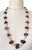 Striking vintage 1970s necklace with authentic character, featuring natural amethyst in graduated faceted stones, combined...