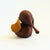 A mid century turned wood figurine in the shape of an Elephant. Adorable stylized features with suede ears and tail. Made...