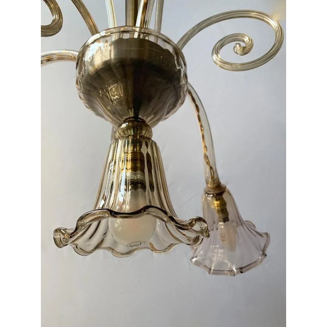 Beautiful chandelier with 4 lights probably processing of the chapellin venini company medium -sized chandelier. structure...