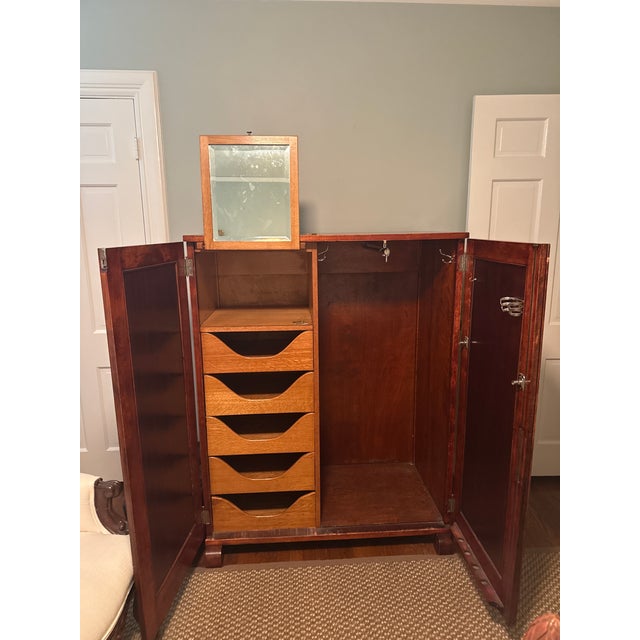 This chifferobe is in excellent condition, with all original hardware, and likely walnut veneer over solid wood. The oak...