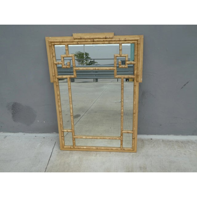 Vintage Faux Bamboo Wood Mirror sold as found in vintage condition previously owned and used showing normal signs of wear.
