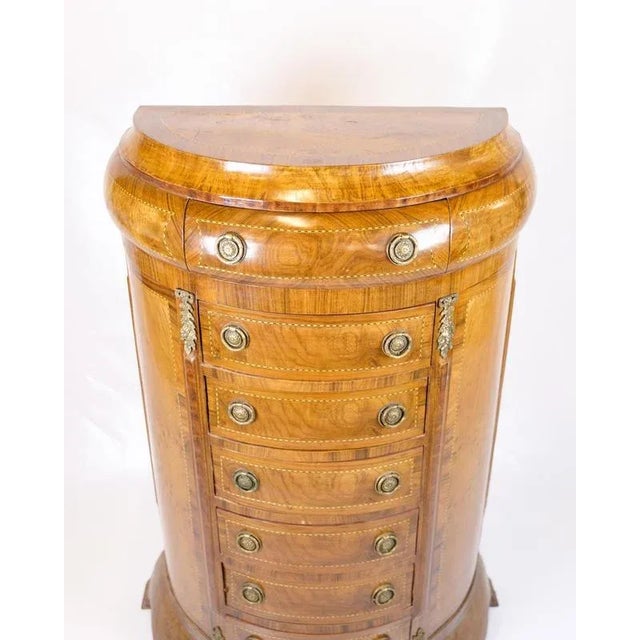 Antique high chest of drawers from the 1890s made in the Klunke style. The chest of drawers is made of rosewood with a...