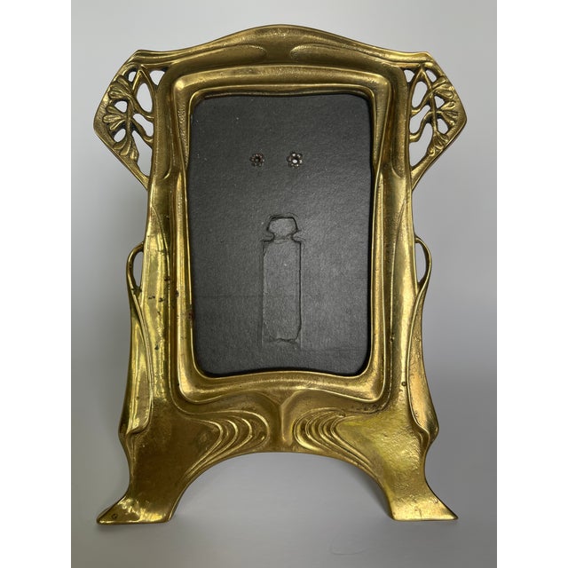 Vienna Secession style Solid cast brass picture frame with fine black cardboard stand. There is a steel wire attached for...